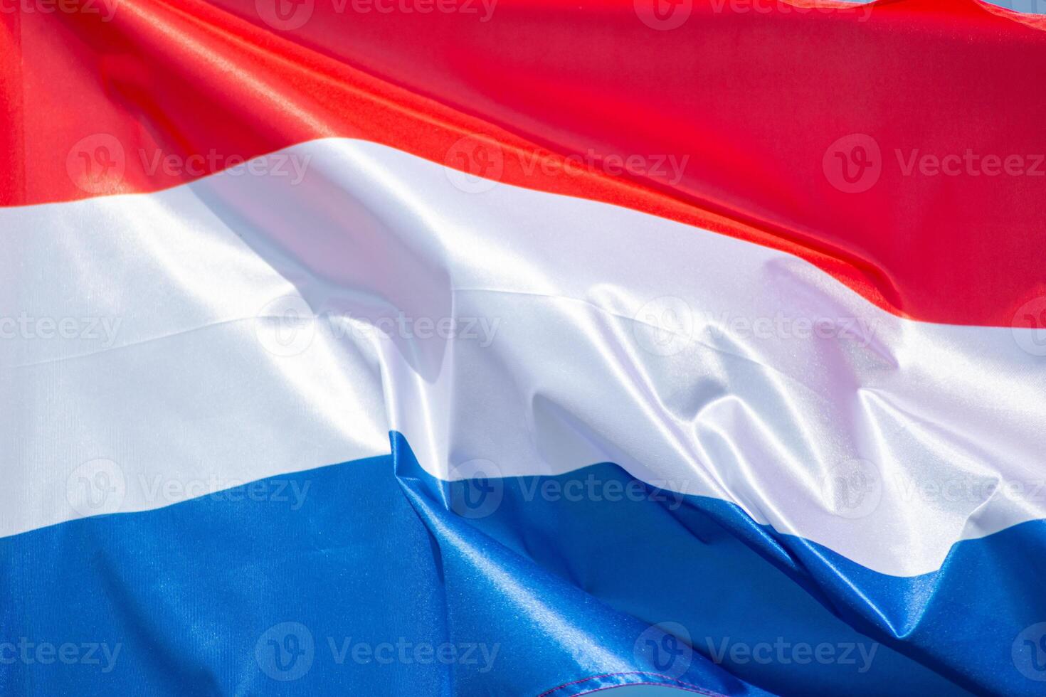detail of a french flag fluttering in the wind photo