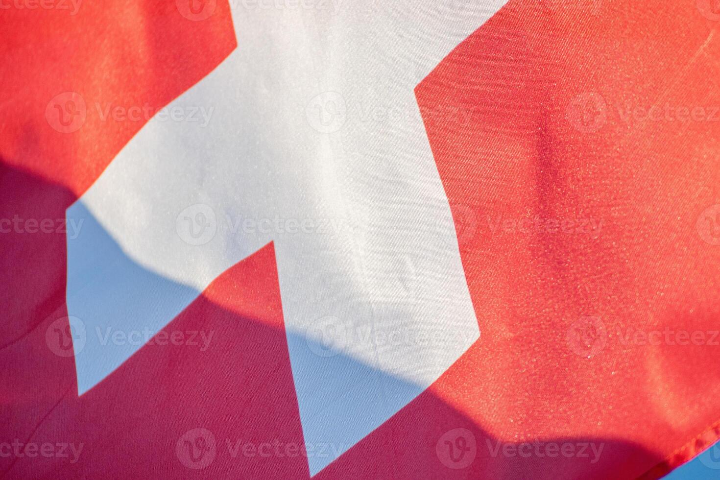 detailed close up of a Swiss flag waving photo