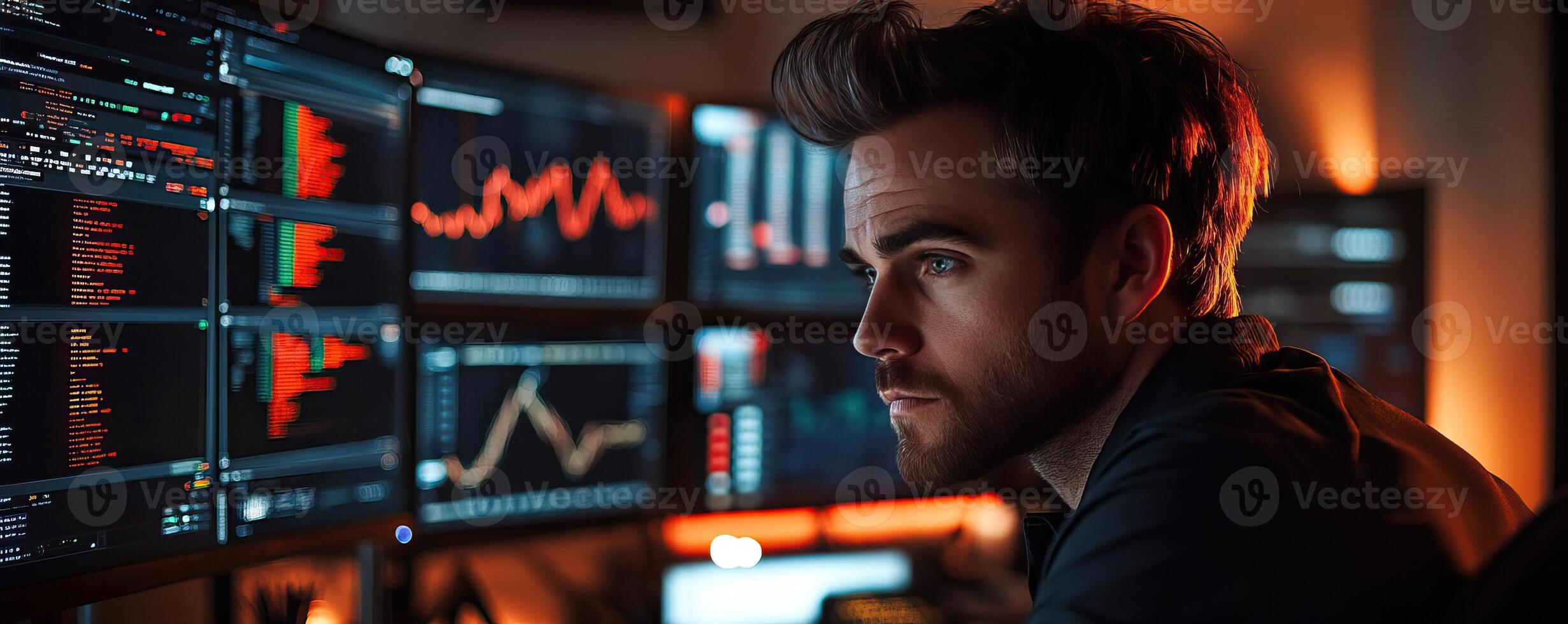 A handsome trader stands at his desk analyzing high definition computer monitors orderly displaying price action and order flow He is zen, a master of meditation and visualization photo
