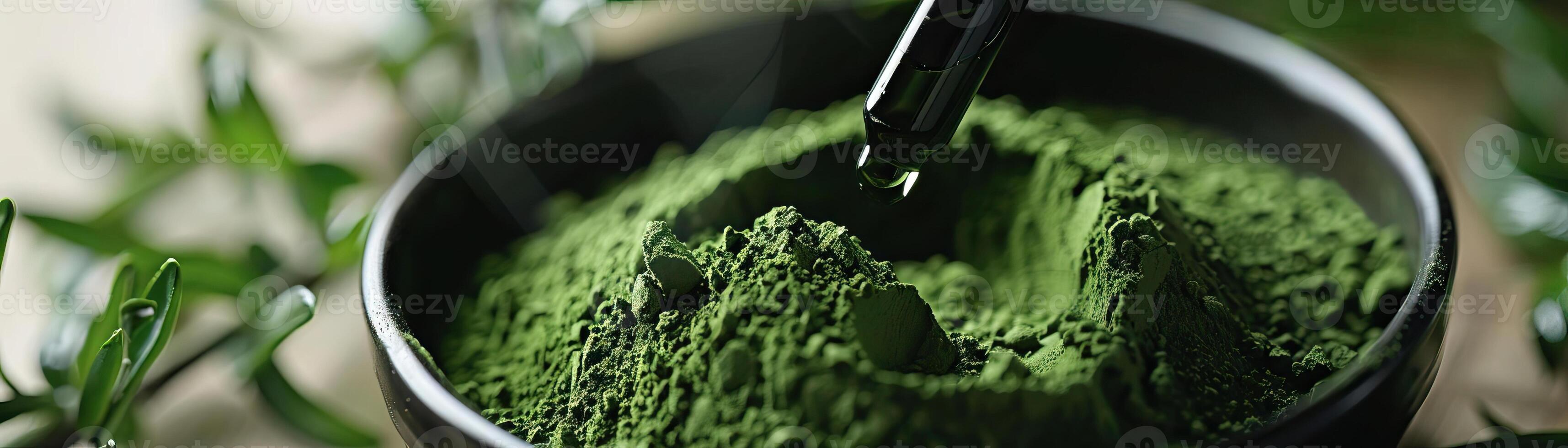 Closeup of matcha extract in a dropper bottle. photo