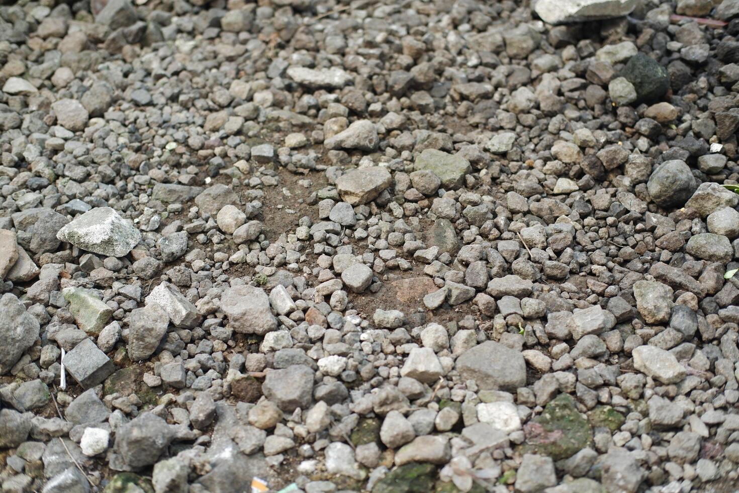 Rocky ground texture, closeup of stone floor surface background. photo