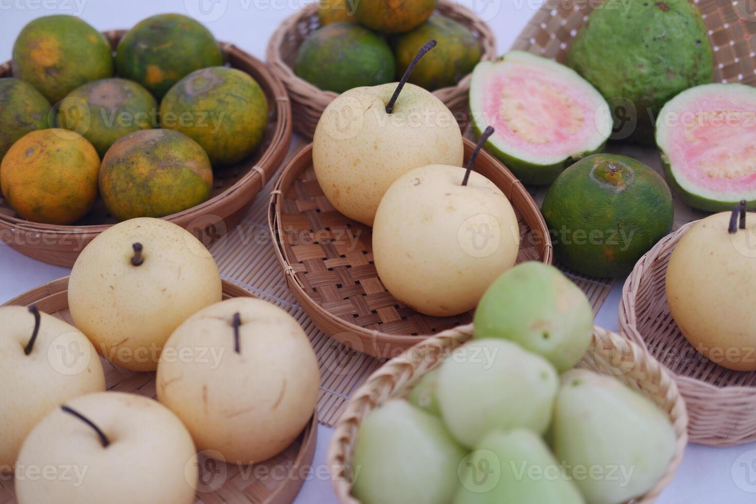 various kinds of fruit in basket on white background. photo
