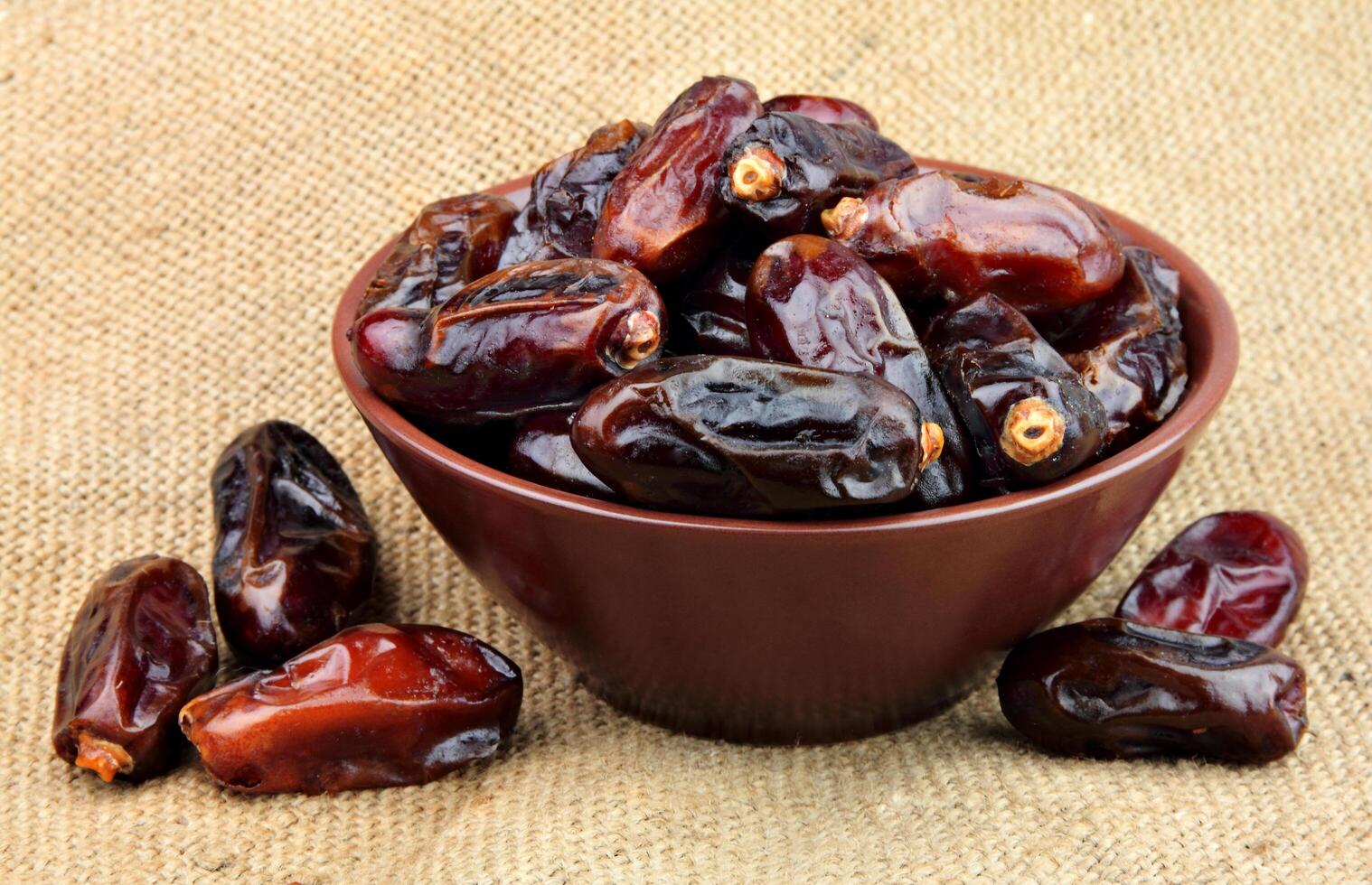 Dried dates in plate photo