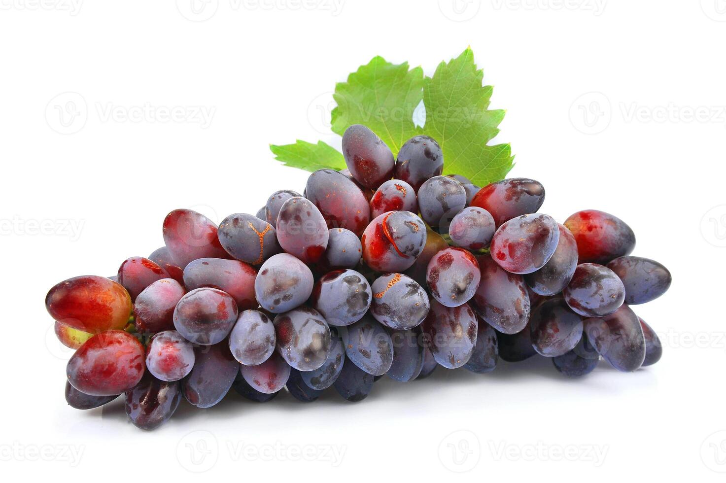 Red grapes with green leaf photo