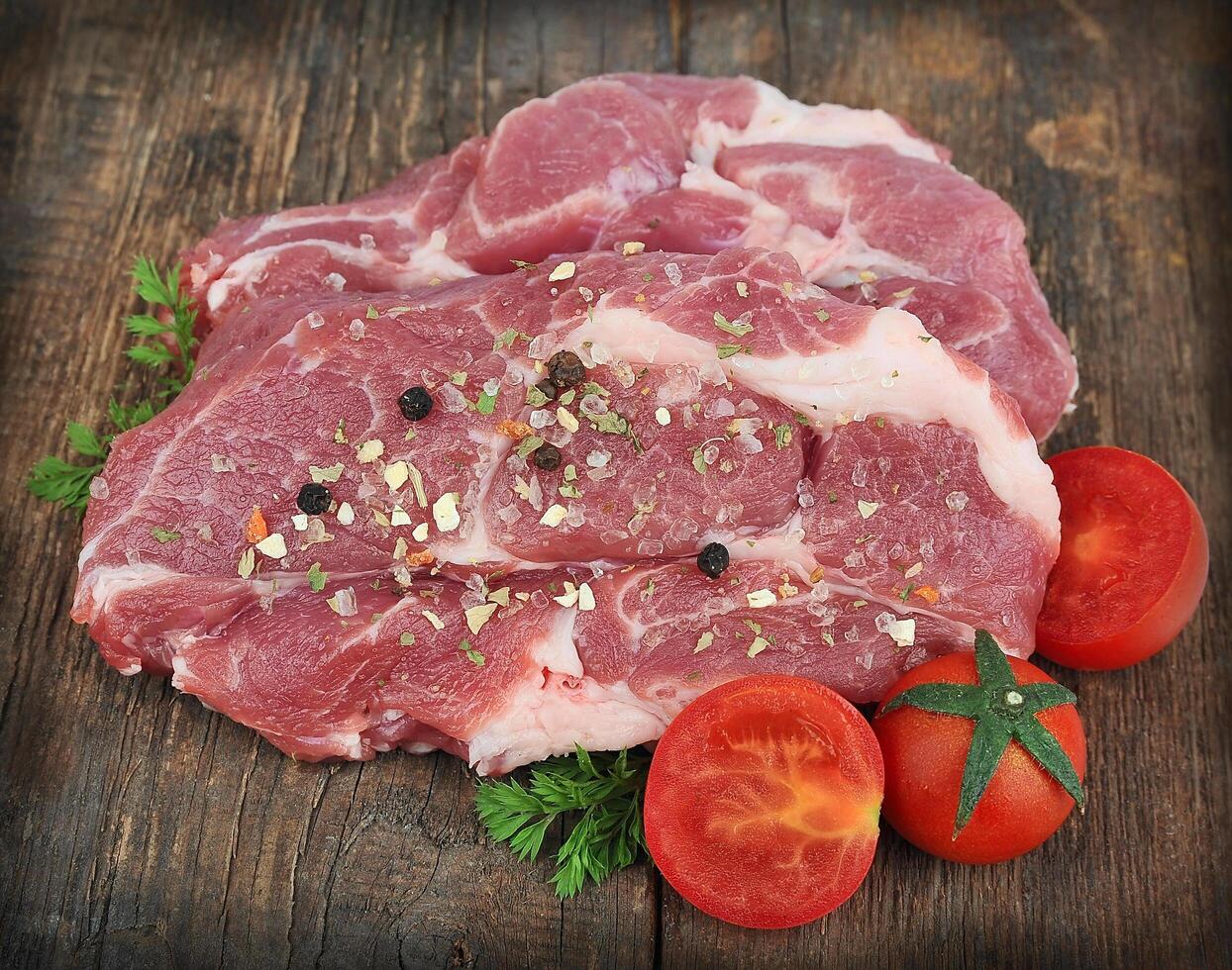 raw steak with spice photo