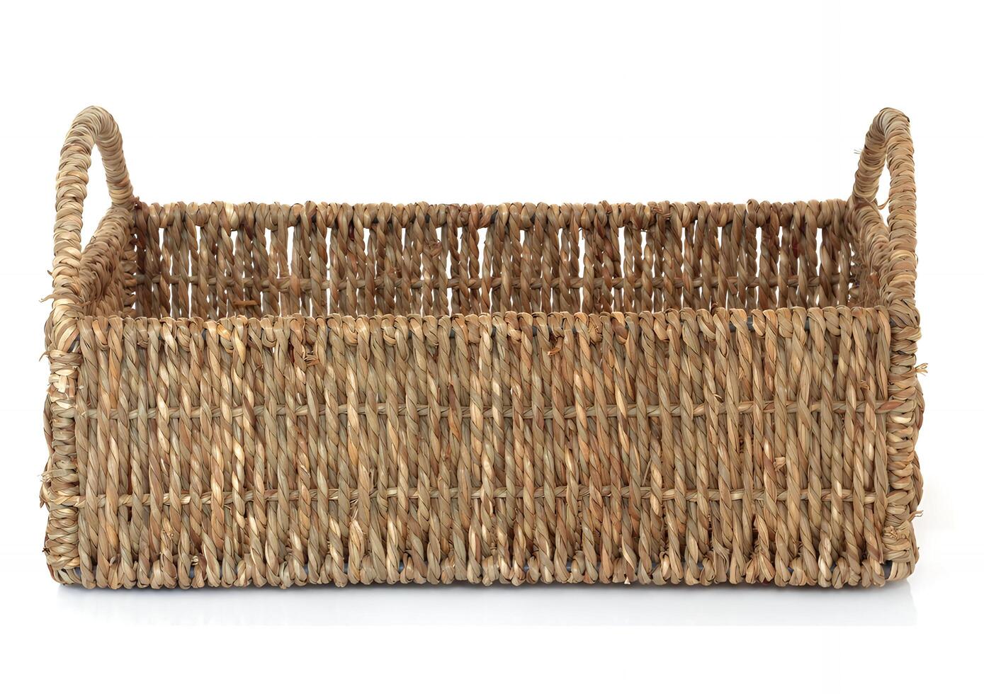 A wicker basket with handles isolated on white background photo