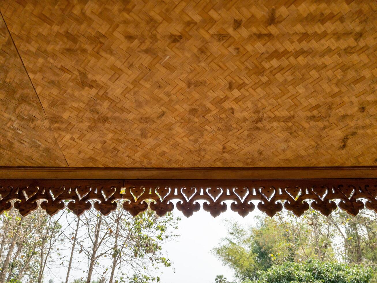 The wooden eaves with the flower stencil. photo