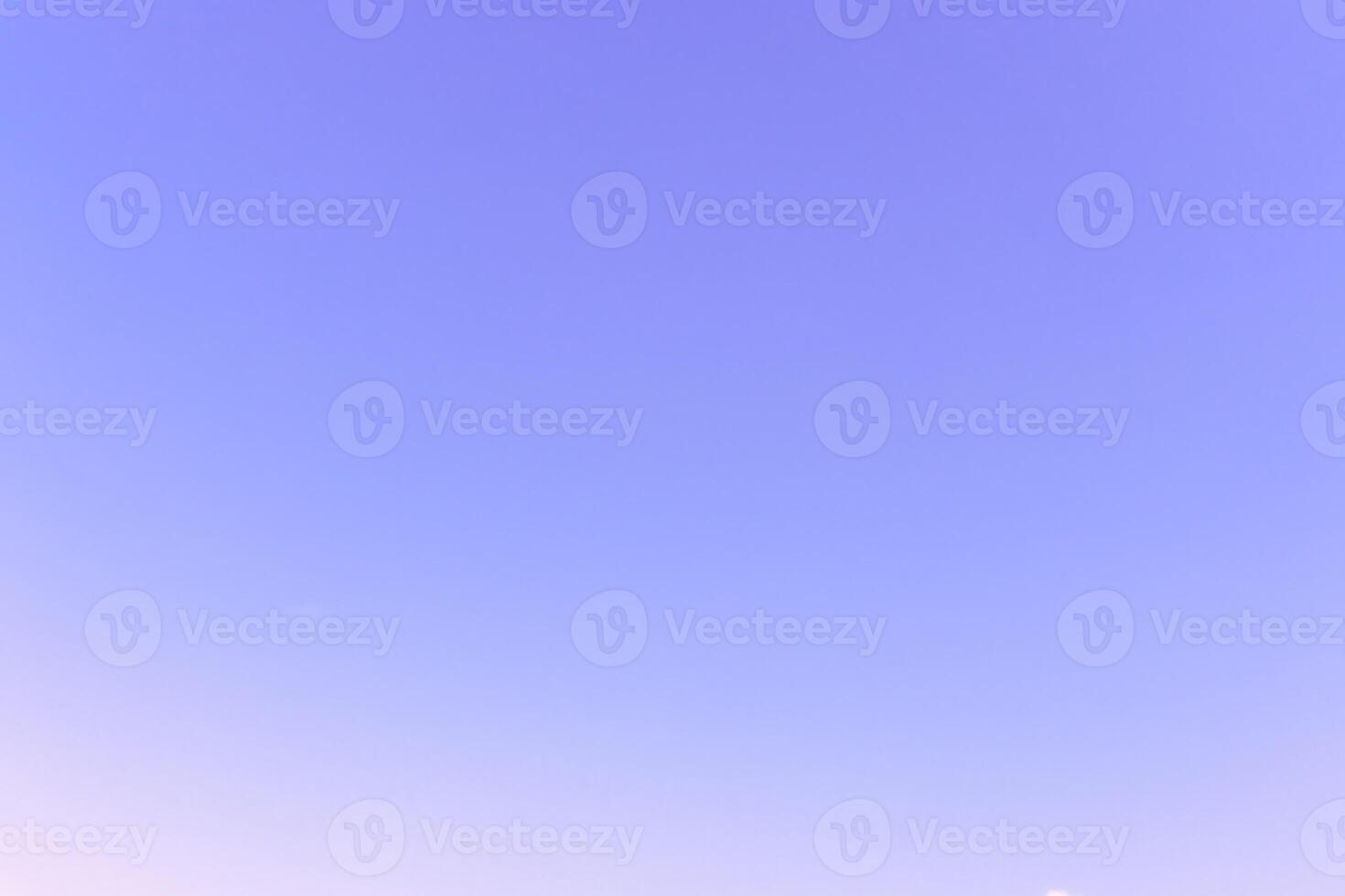 Low angle view of beautiful light blue sky taken in the morning or evening used as natural background texture in decorative art work photo