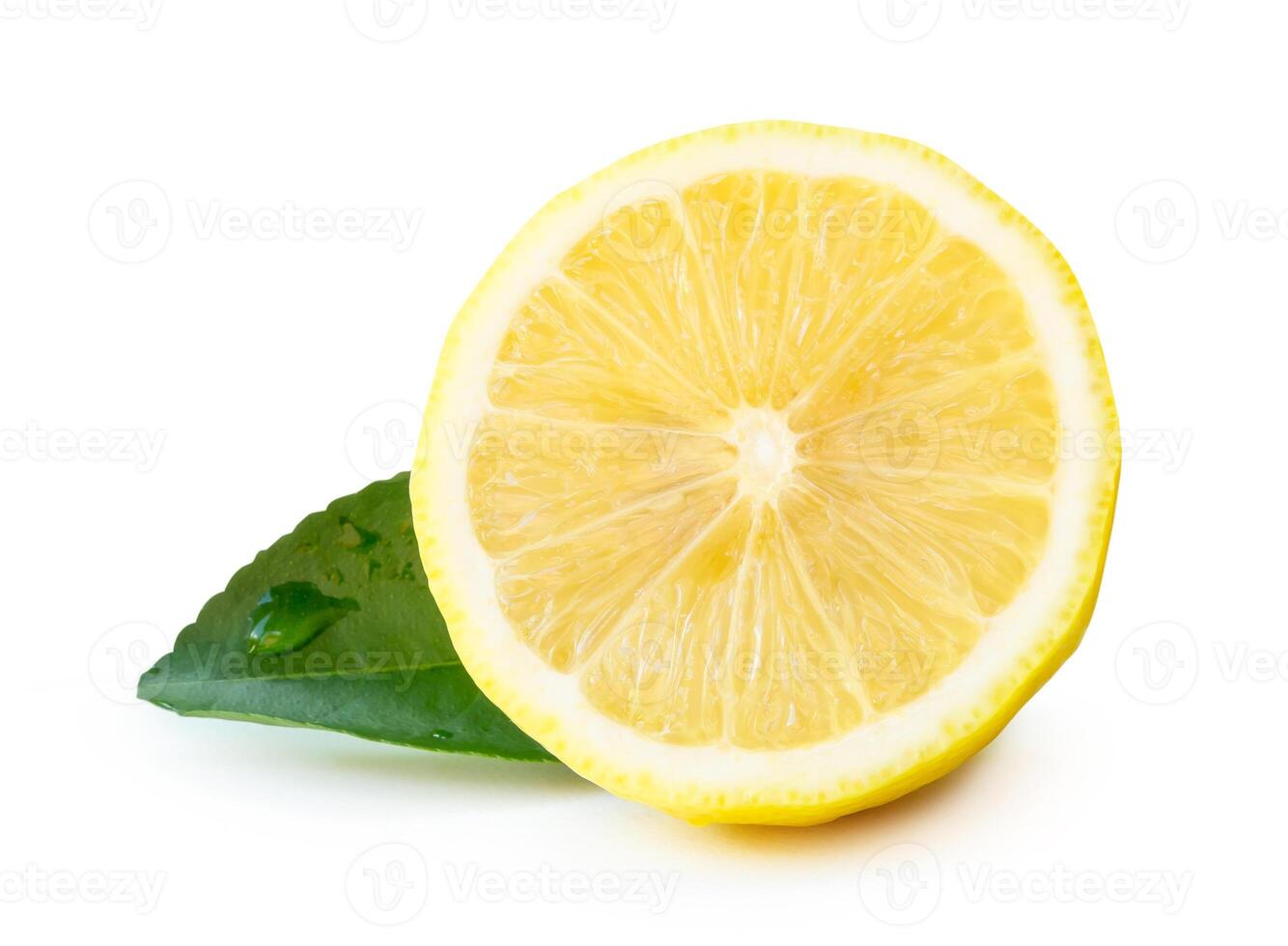 Front view of yellow lemon half with green leaf isolated on white background with clipping path photo