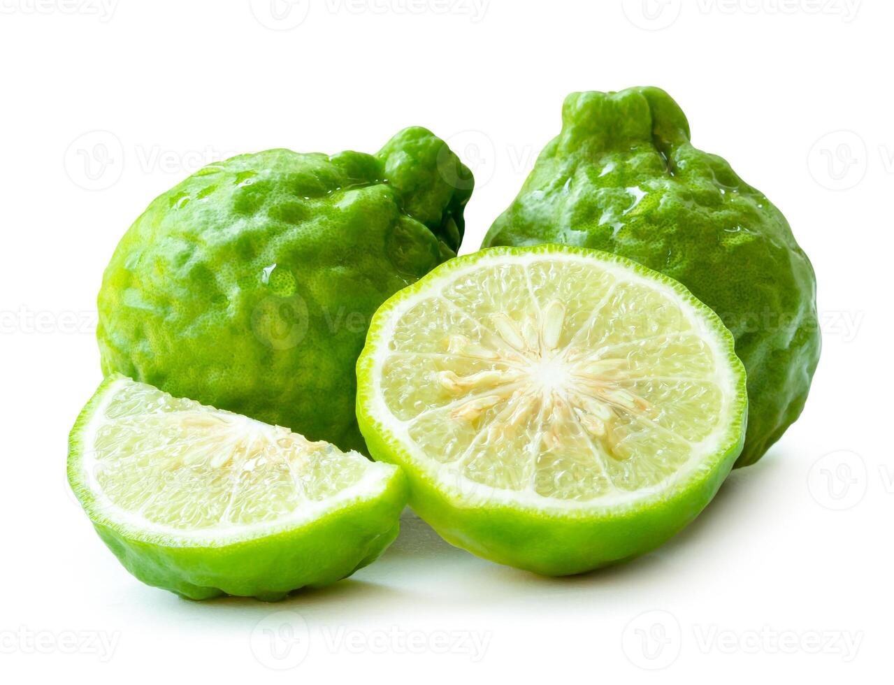 Front view of fresh green bergamot fruit with half and slice or quarter in stack isolated on white background with clipping path photo