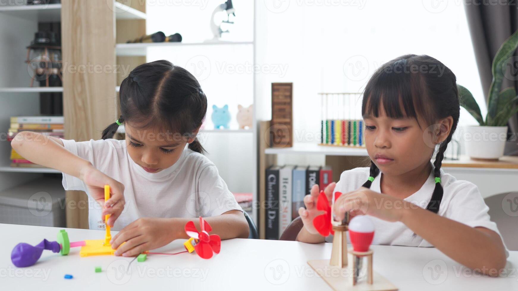STEM education concept. Asian students learn at home with STEM toys, mathematics engineering science technology computer code in robotics for kids' concepts. photo