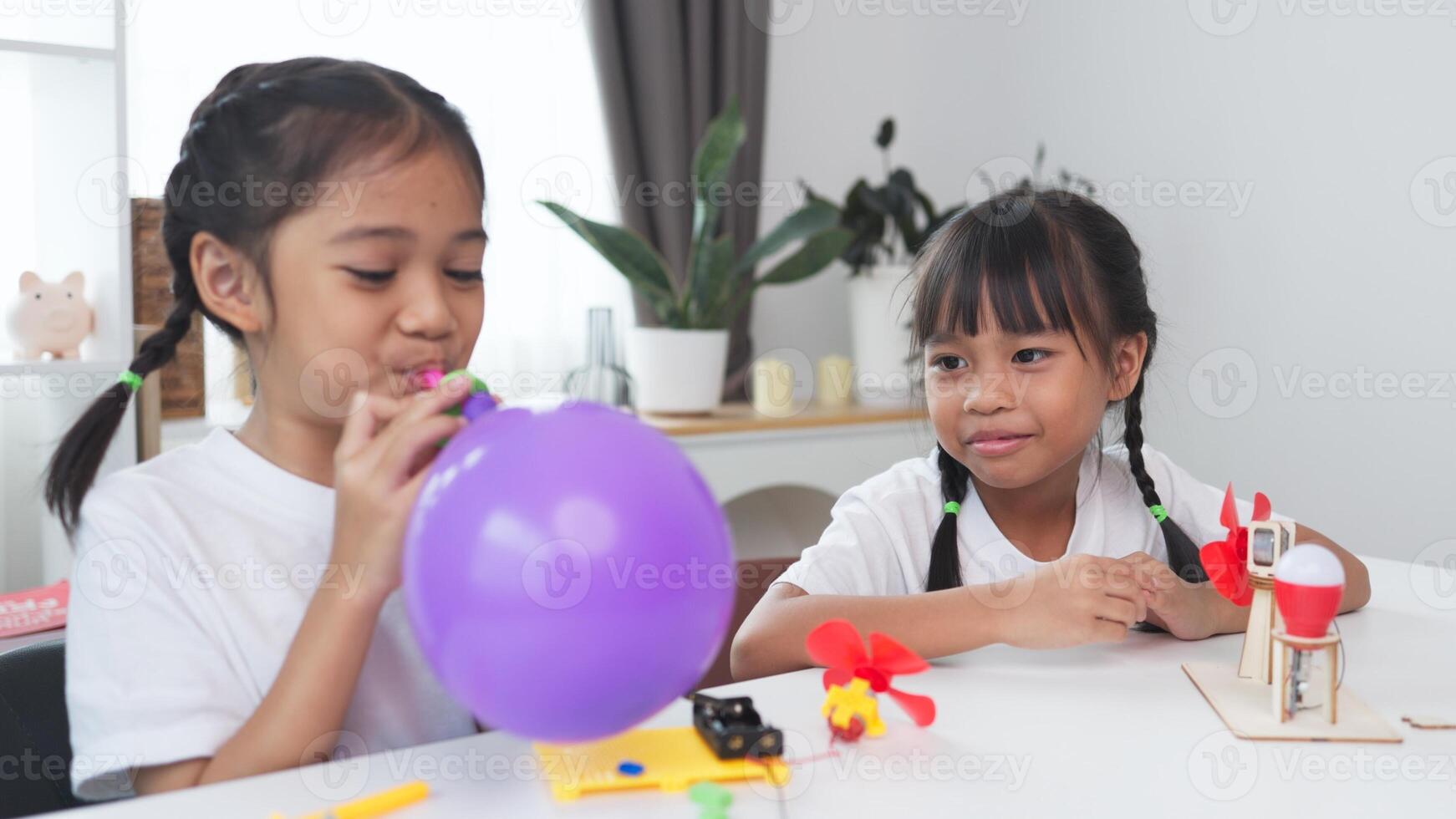 STEM education concept. Asian students learn at home with STEM toys, mathematics engineering science technology computer code in robotics for kids' concepts. photo