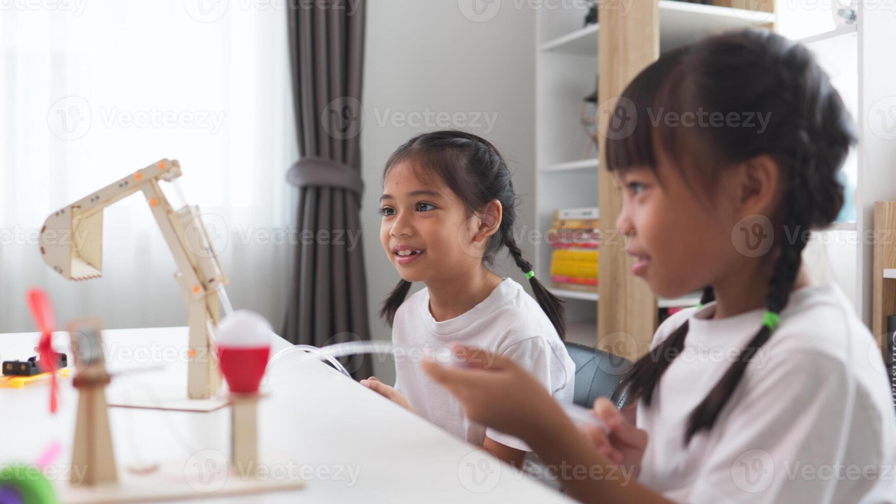 STEM education concept. Asian students learn at home with STEM toys, mathematics engineering science technology computer code in robotics for kids' concepts. photo
