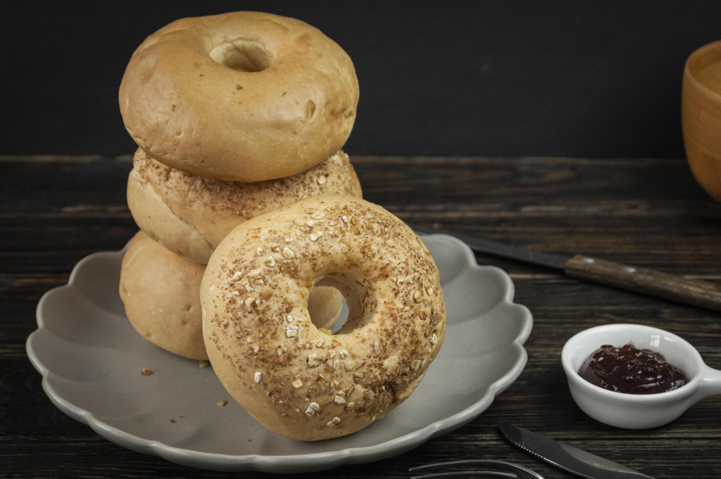 a stack of bagels on a plate photo