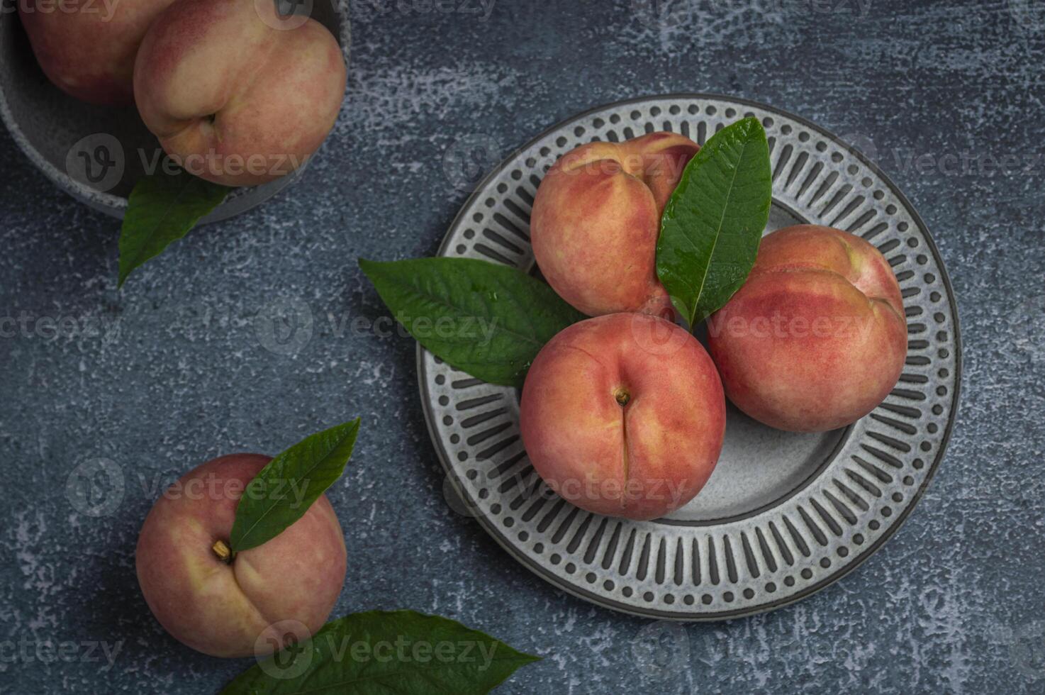 fresh peaches on a plate photo