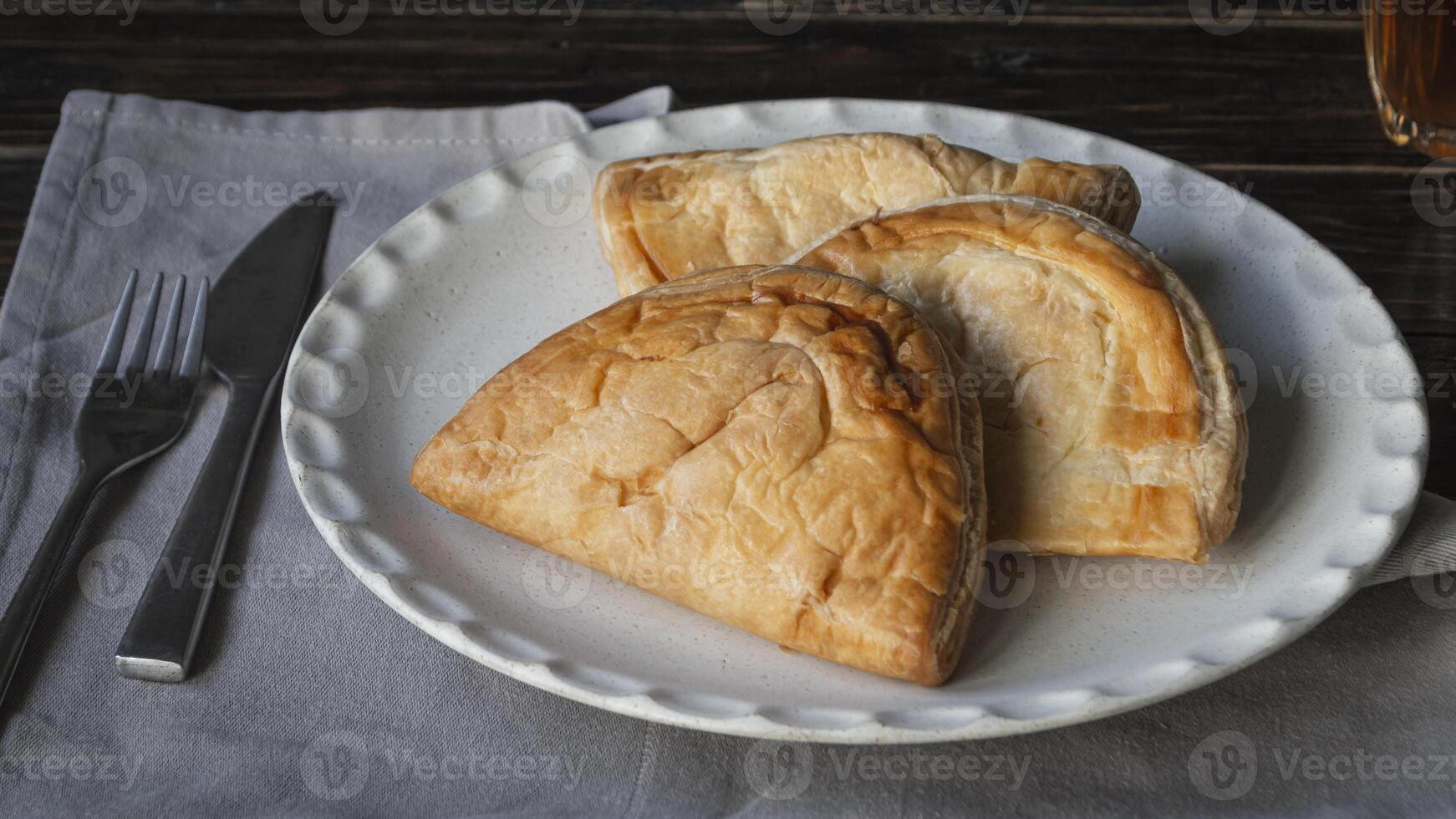 a plate with three pie on it photo