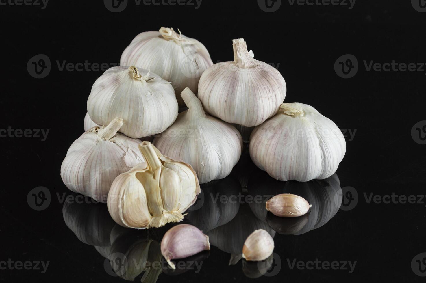 garlic on black background photo