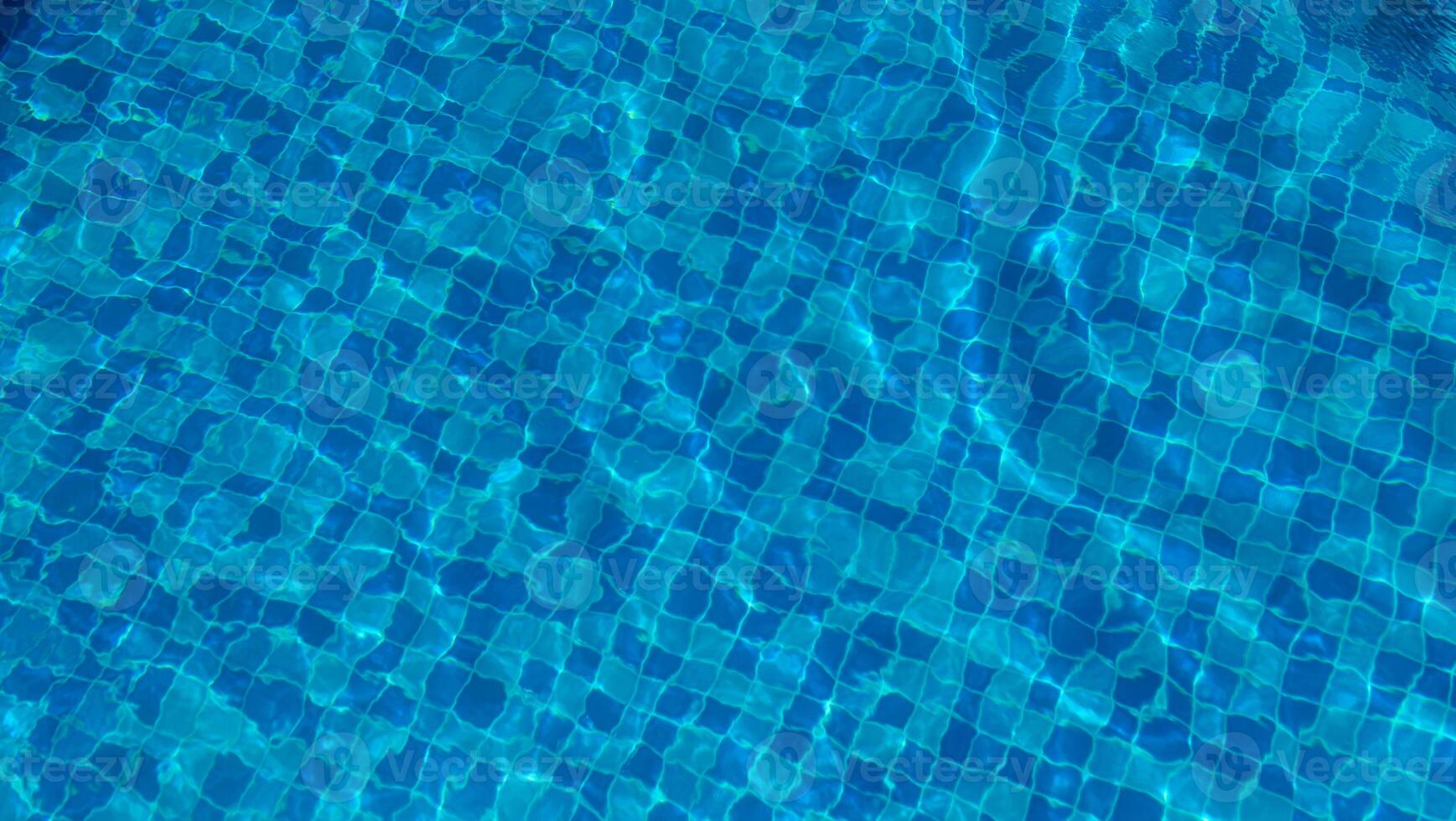Swimming Pool Surface With Light Reflection and Water Ripple Patterns photo