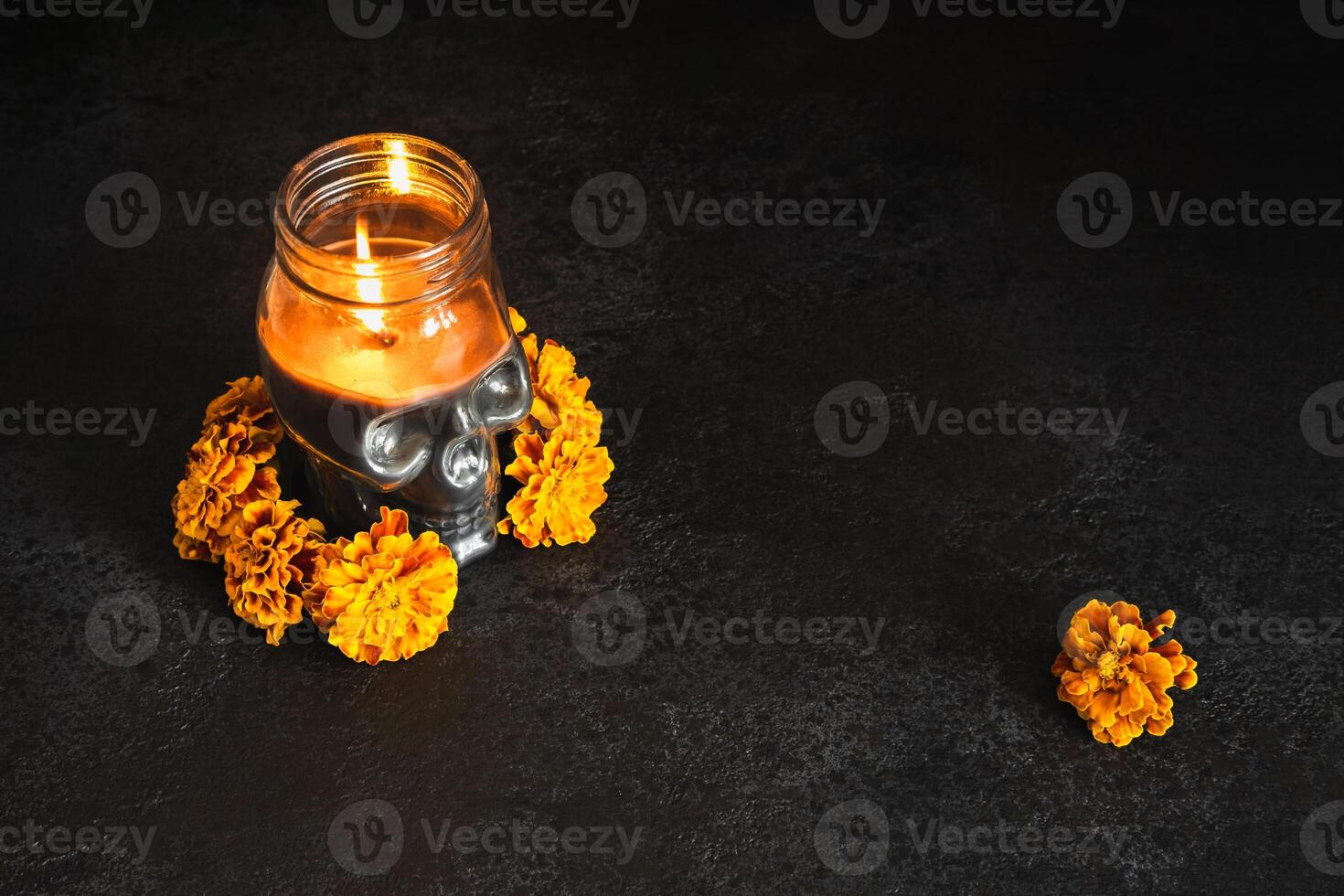 Skull with marigold flowers wreath on black background. Dia de los muertos day or day of the dead photo