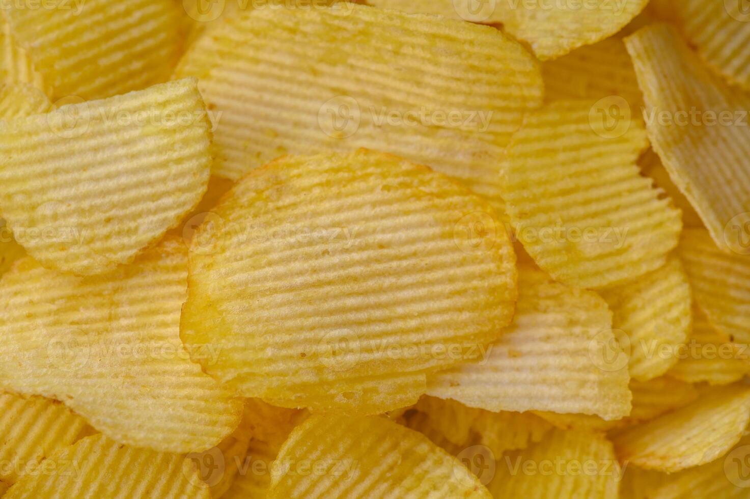 Potato chips snack as background image texture background. Copy, empty space for text photo