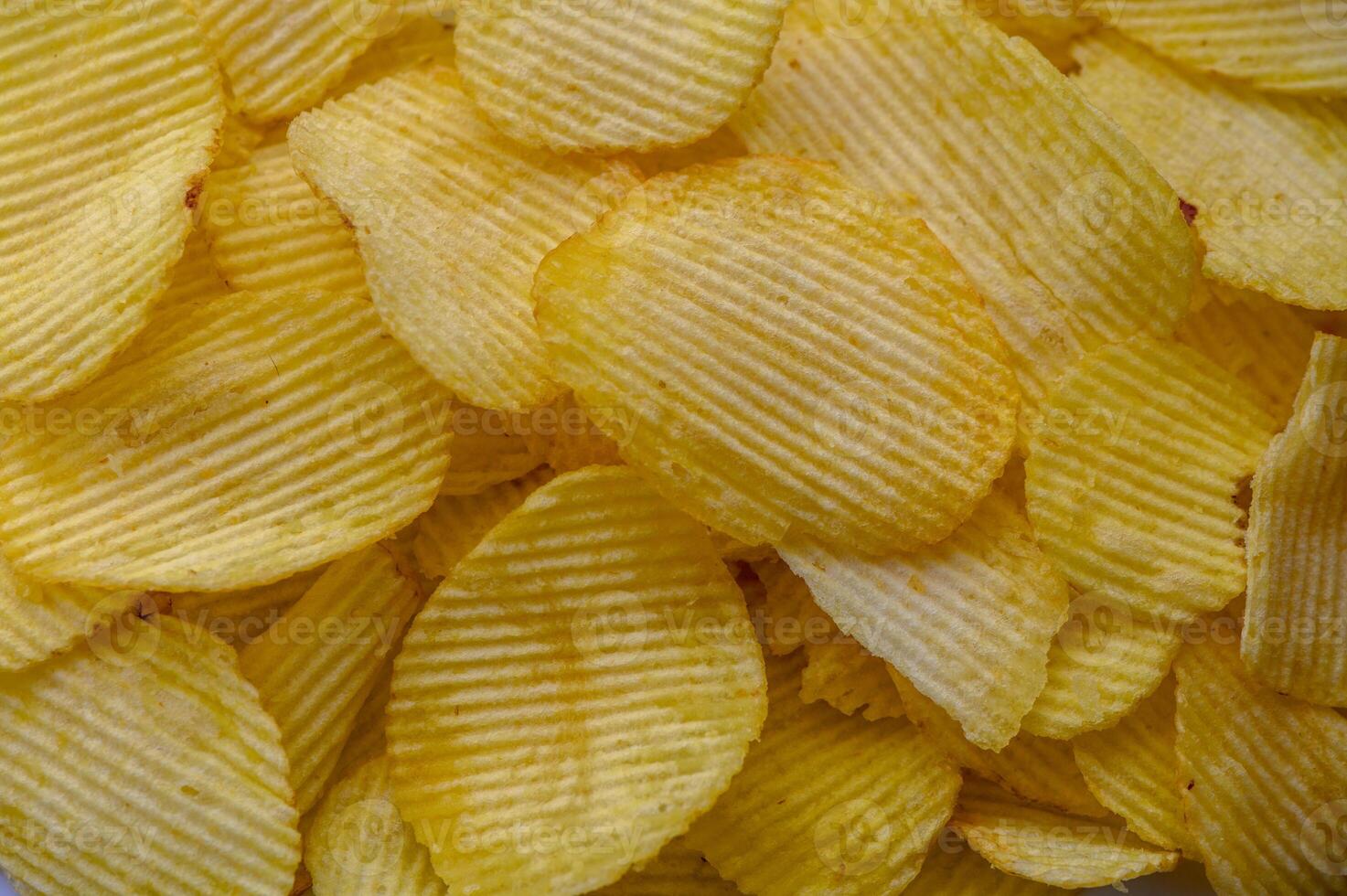 Crispy potato chips snack texture background. Top view. Flat lay 1 photo