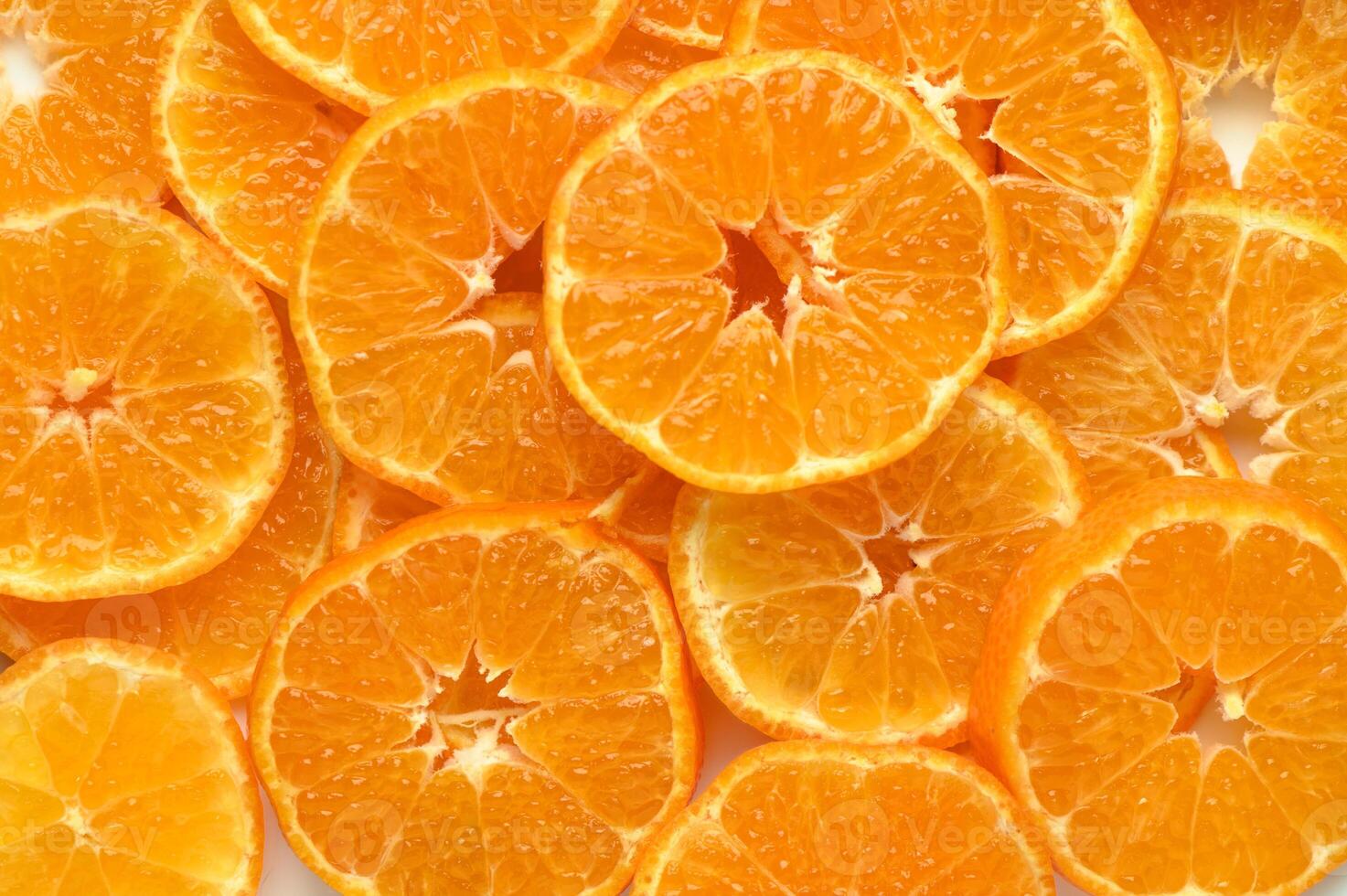 juicy and appetizing tangerines cut into circles as a food background 4 photo