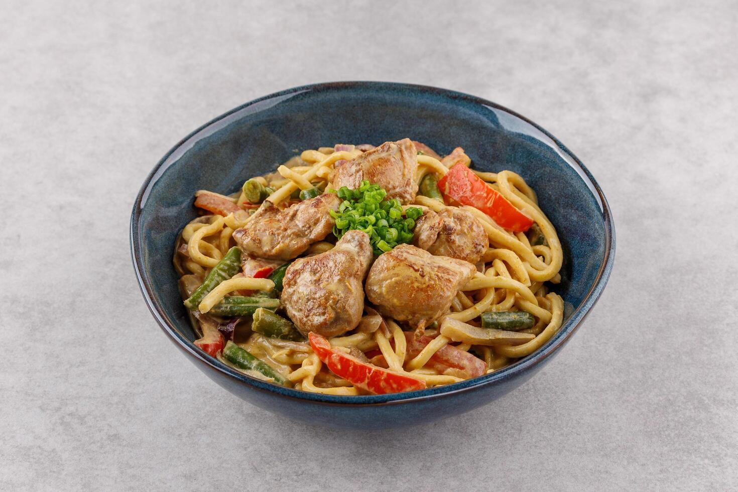 Wok with creamy curry on stone background studio shot 1 photo