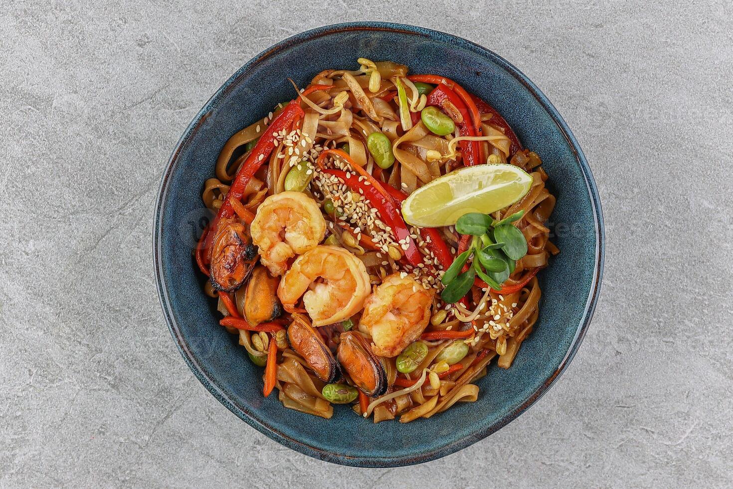 Wok with seafood studio shooting on a white background 3 photo