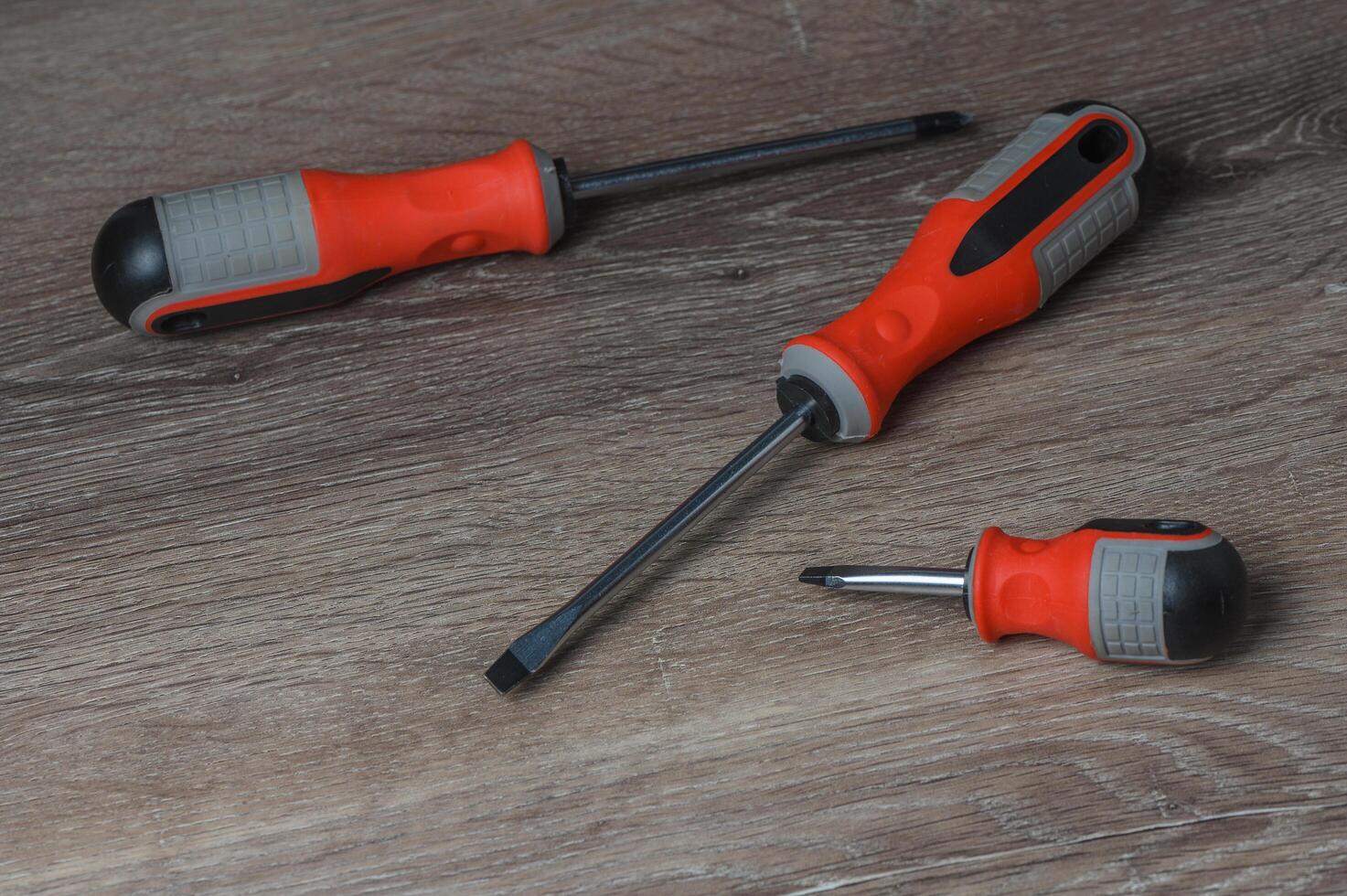 Screwdriver set on a wooden background top view copy space photo