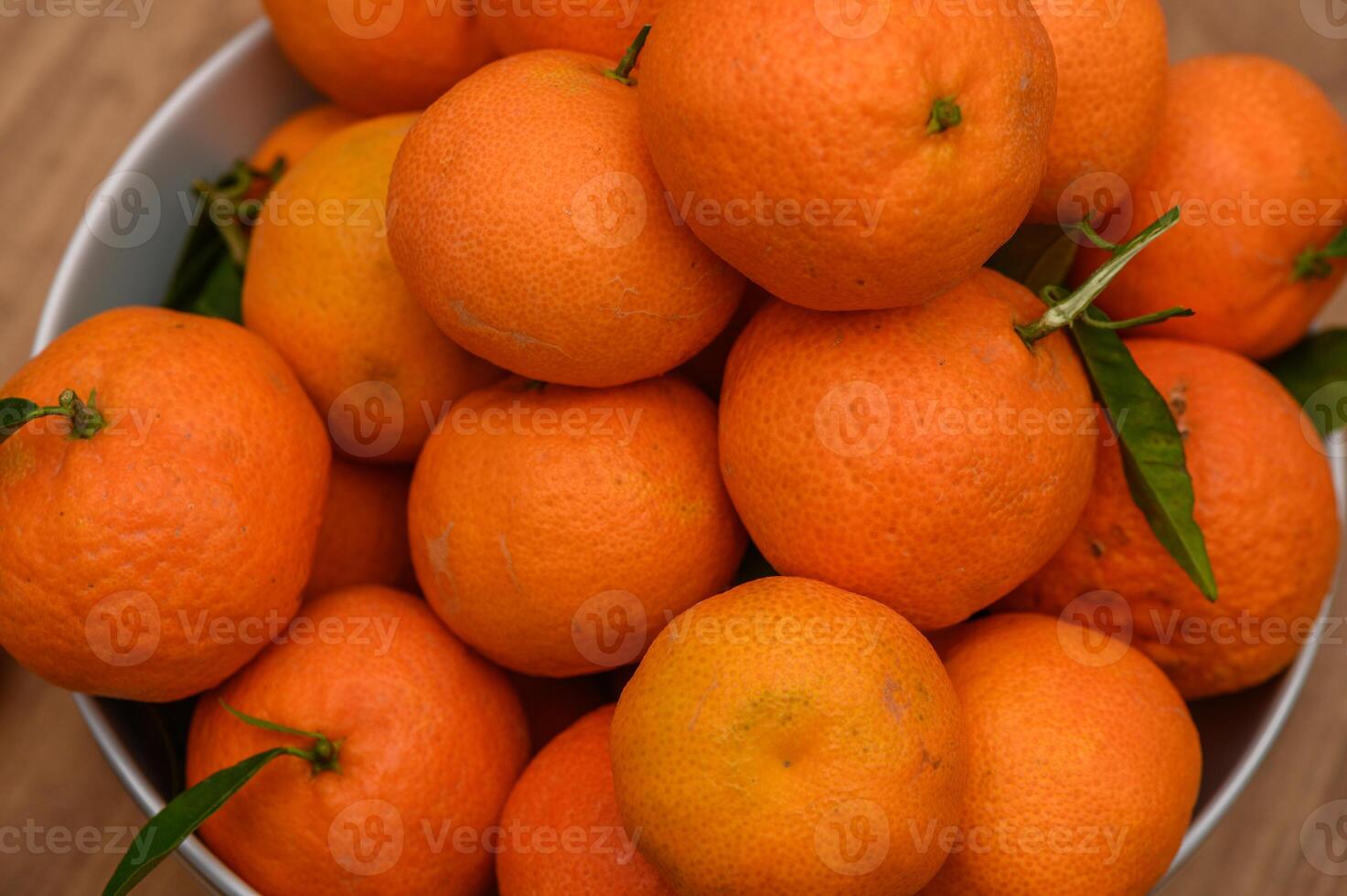 juicy tangerines in a plate on the table 3 photo