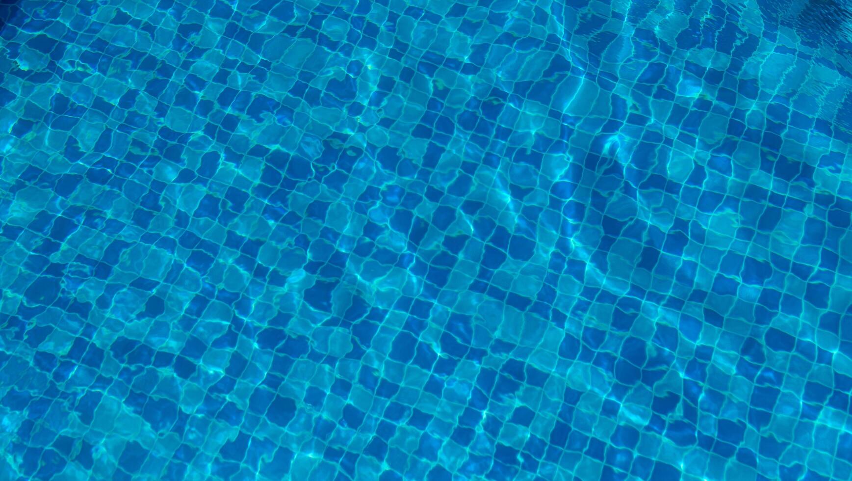 Swimming Pool Surface With Light Reflection and Water Ripple Patterns photo