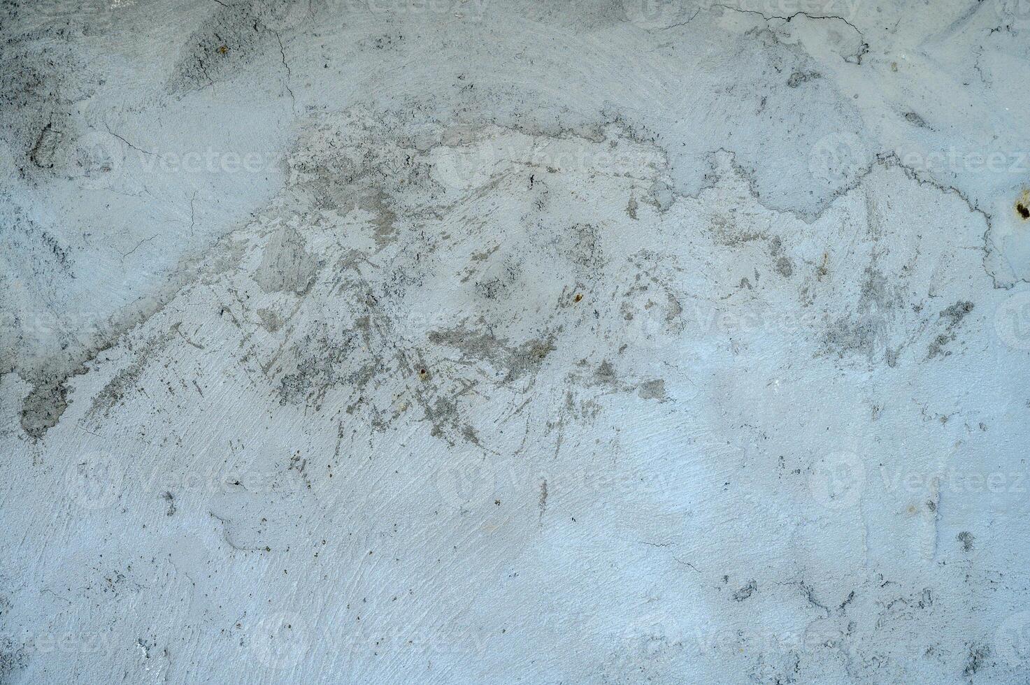 Close-up. Badly fixed building facade wall covered with cracks in stucco and paint photo