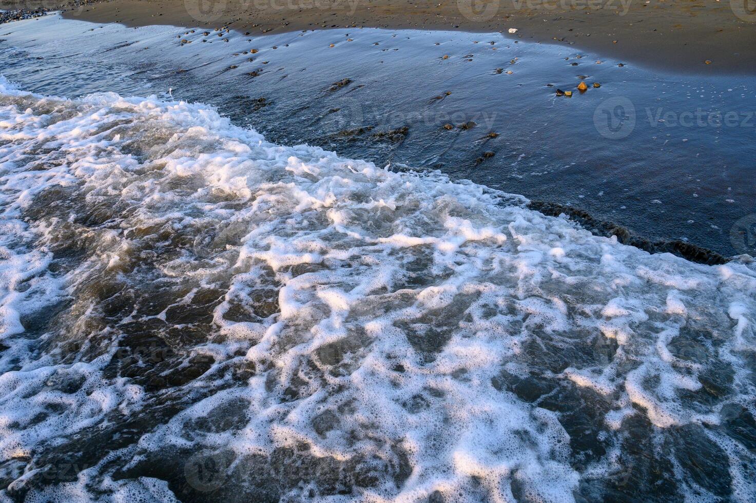 wavy lines water surface with bright glowing reflection abstract background photo