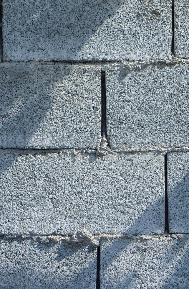 Cinder block wall background texture. Grunge backdrop wallpaper photo