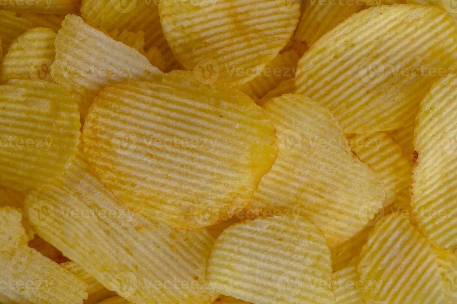 Crispy potato chips texture background top view 1 photo