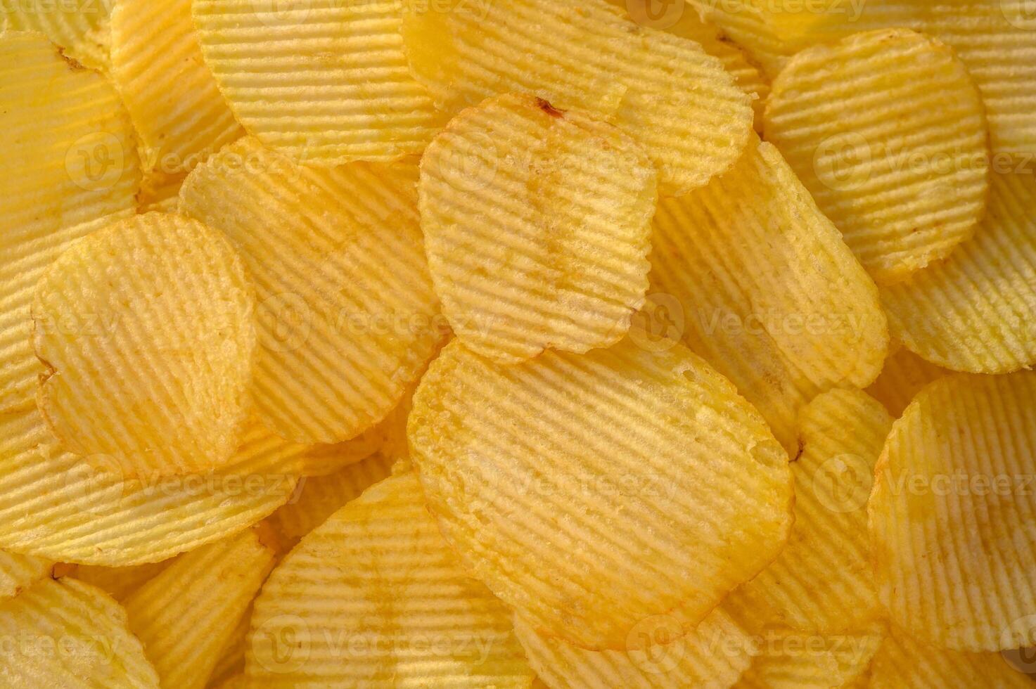 Crispy fresh potato chips, snacks background. Top view, flat lay. Banner photo