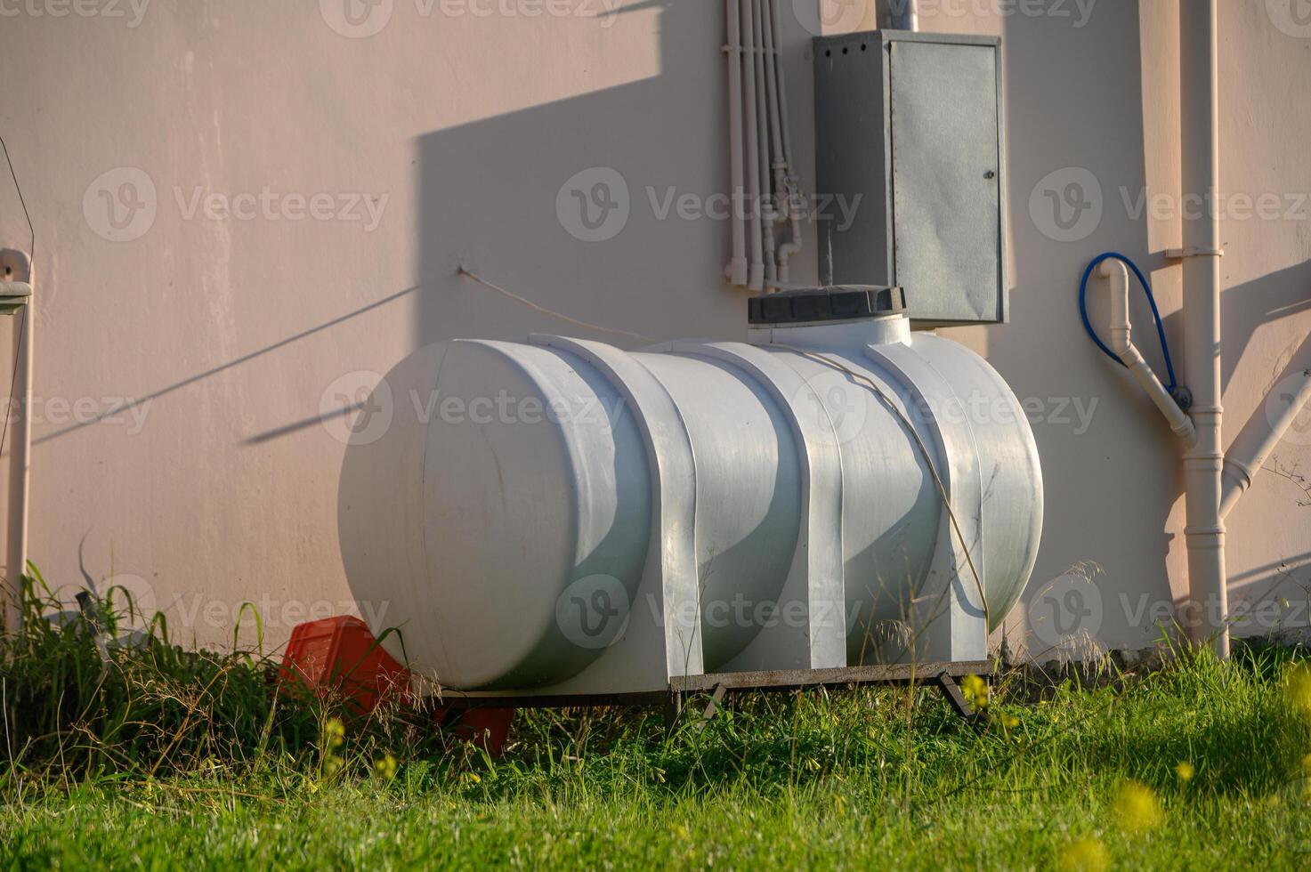 water container near a house in Cyprus 1 photo