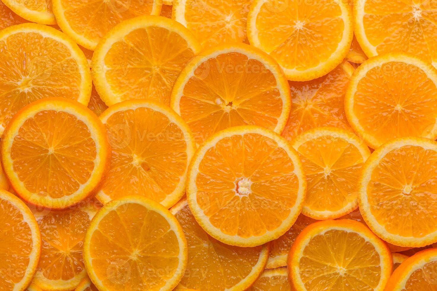 oranges cut into slices and laid out on the table as a food background 4 photo