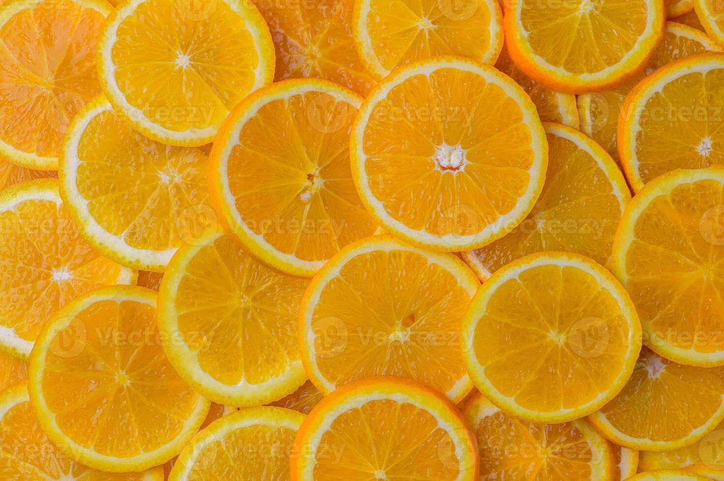 oranges cut into slices and laid out on the table as a food background 9 photo