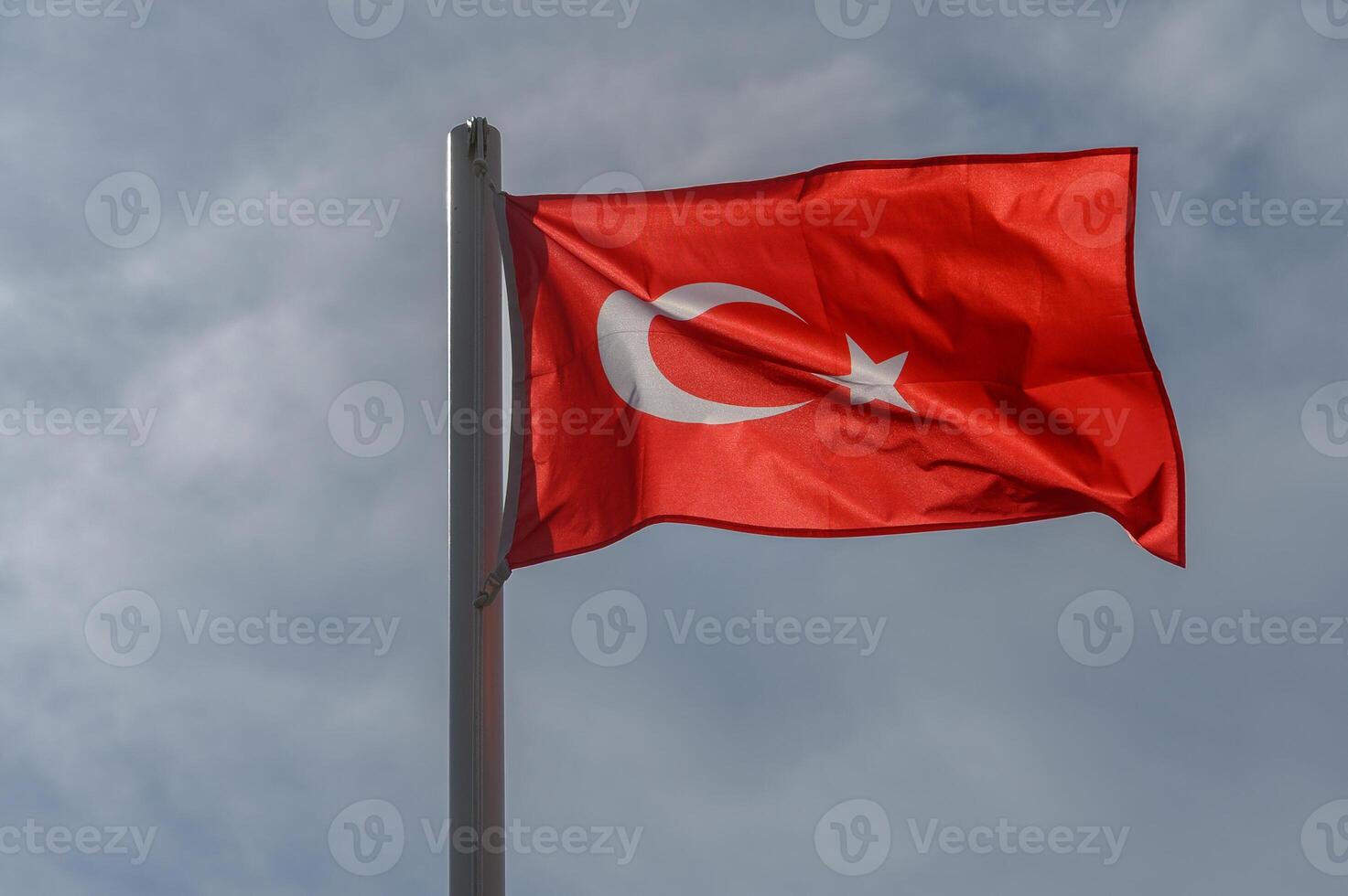 Turkish flag against the sky on a sunny winter day 11 photo