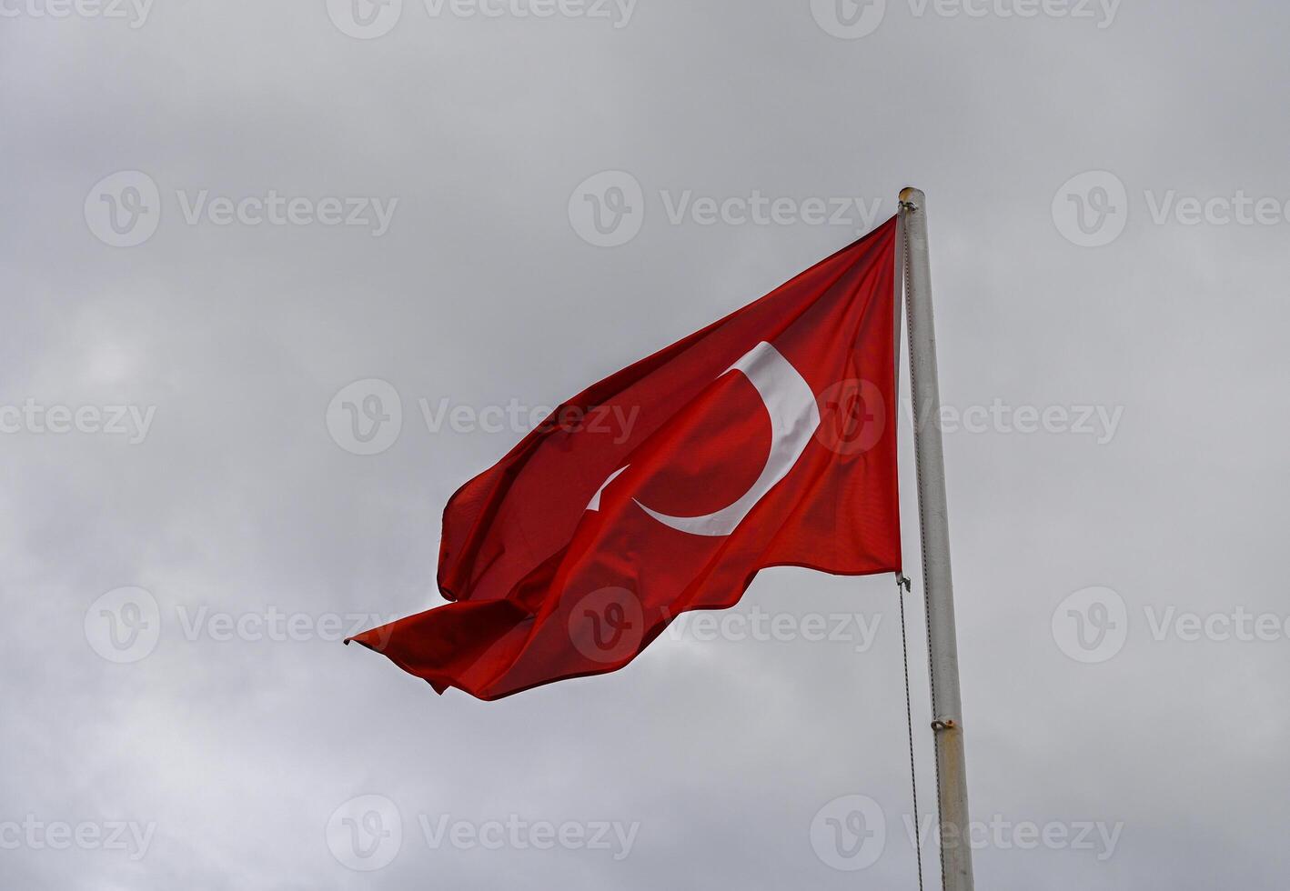 Turkey flag against cloudy sky in winter 2 photo