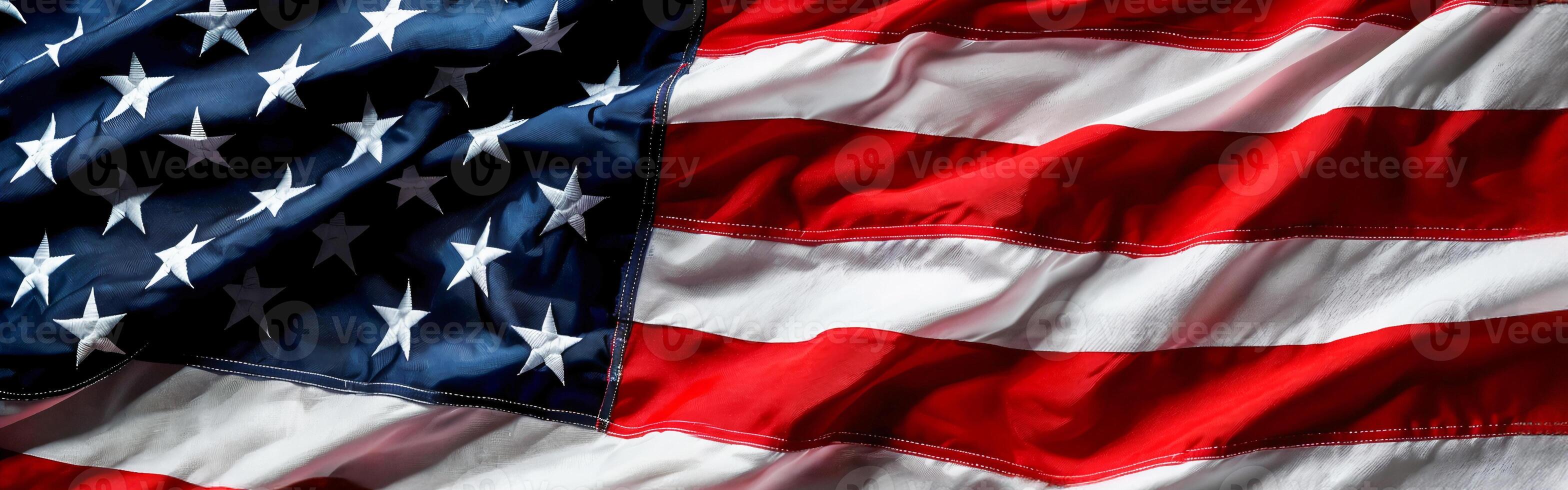 Close-up of the American flag, with its iconic red and white stripes and blue background filled with stars, symbolizing freedom and the USA in celebration or on landmarks day photo