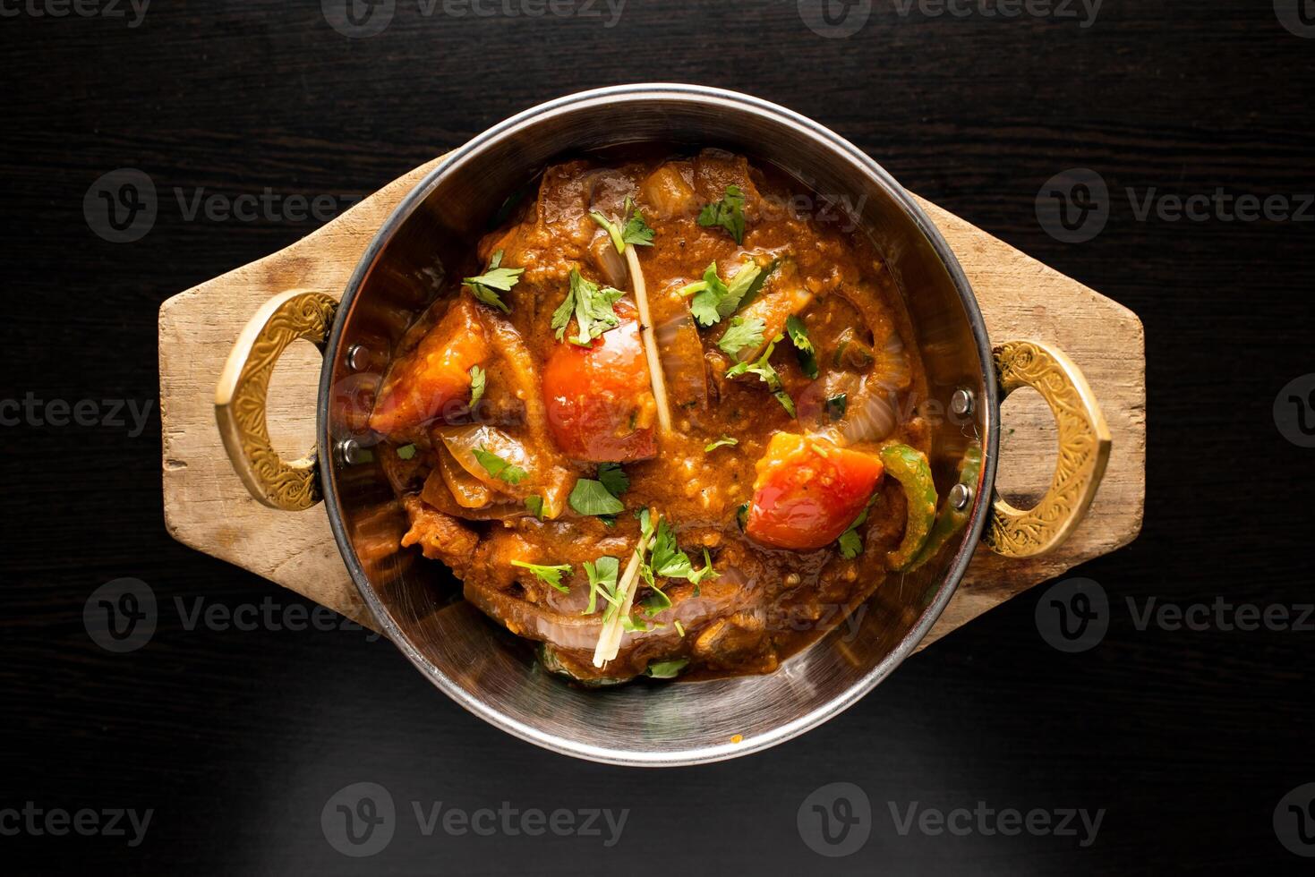 Chicken Jalfrezi include tomato, onion, ginger and coriander served in dish isolated dark background top view of indian spices, bangladeshi and pakistani food photo