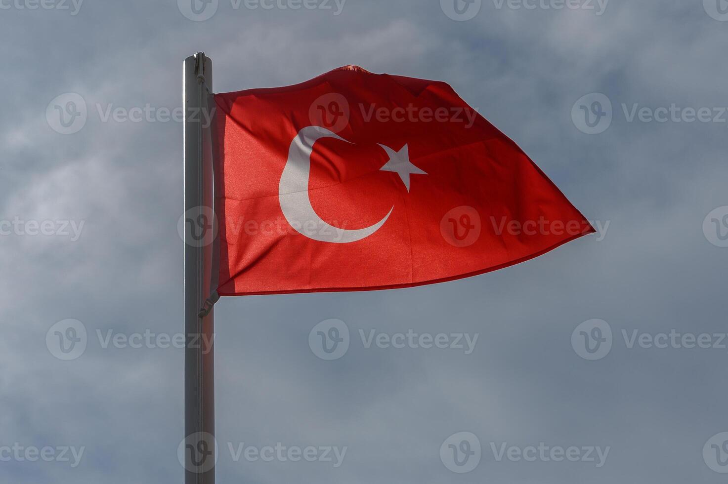 Turkish flag against the sky on a sunny winter day 12 photo