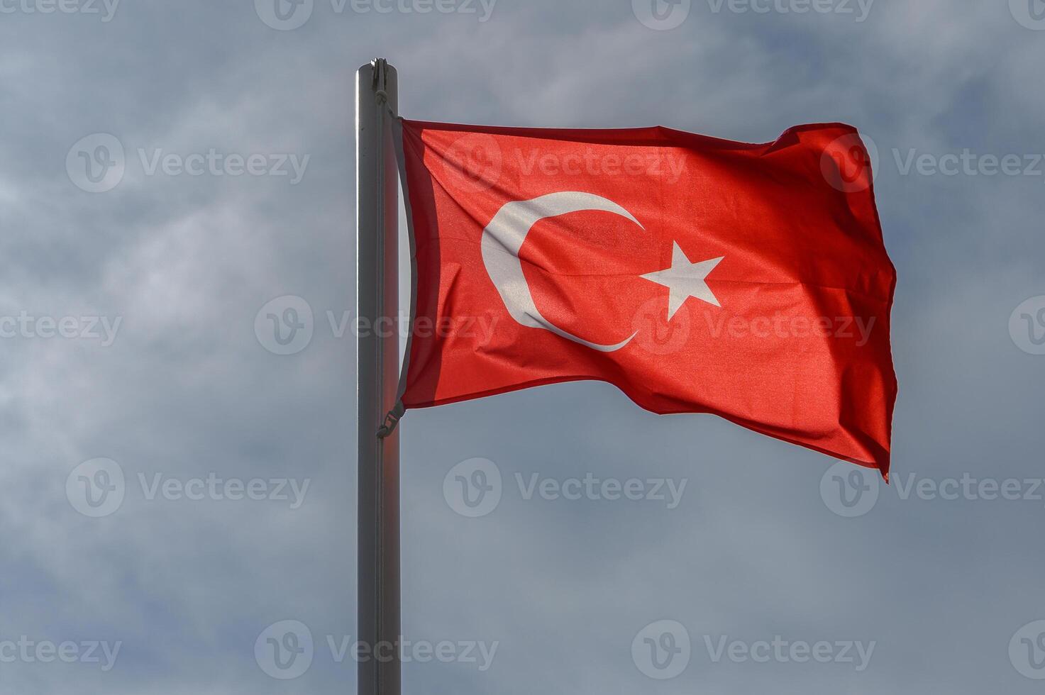 Turkish flag against the sky on a sunny winter day 9 photo