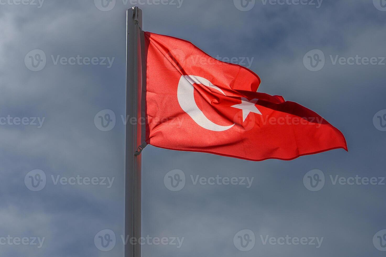 Turkish flag against the sky on a sunny winter day 4 photo