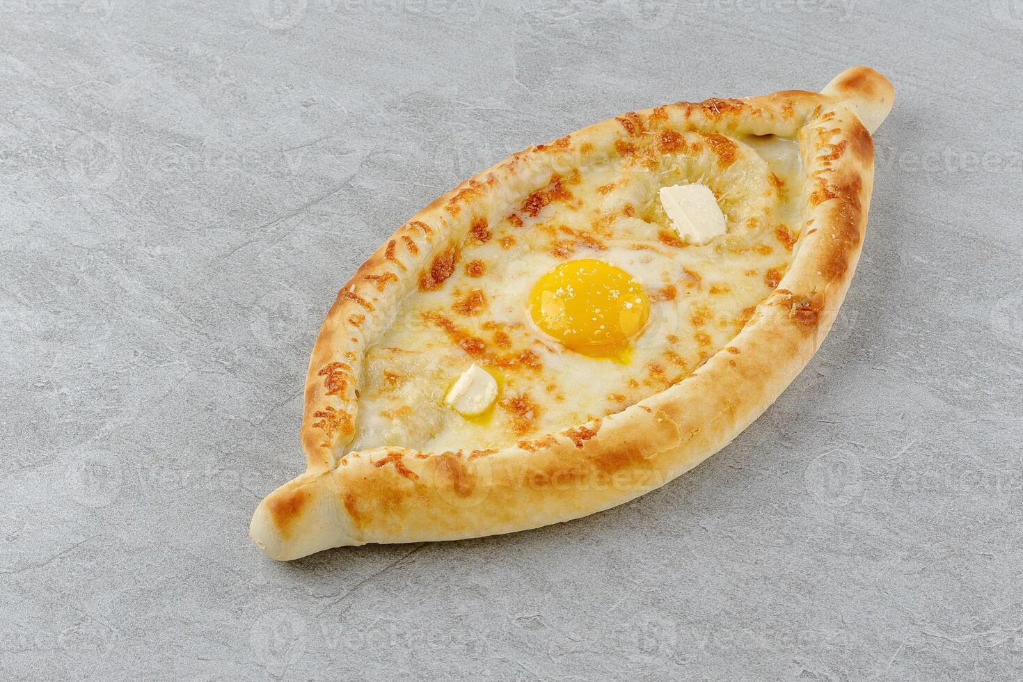 khachapuri in Adjarian style on a stone background studio food photo 1