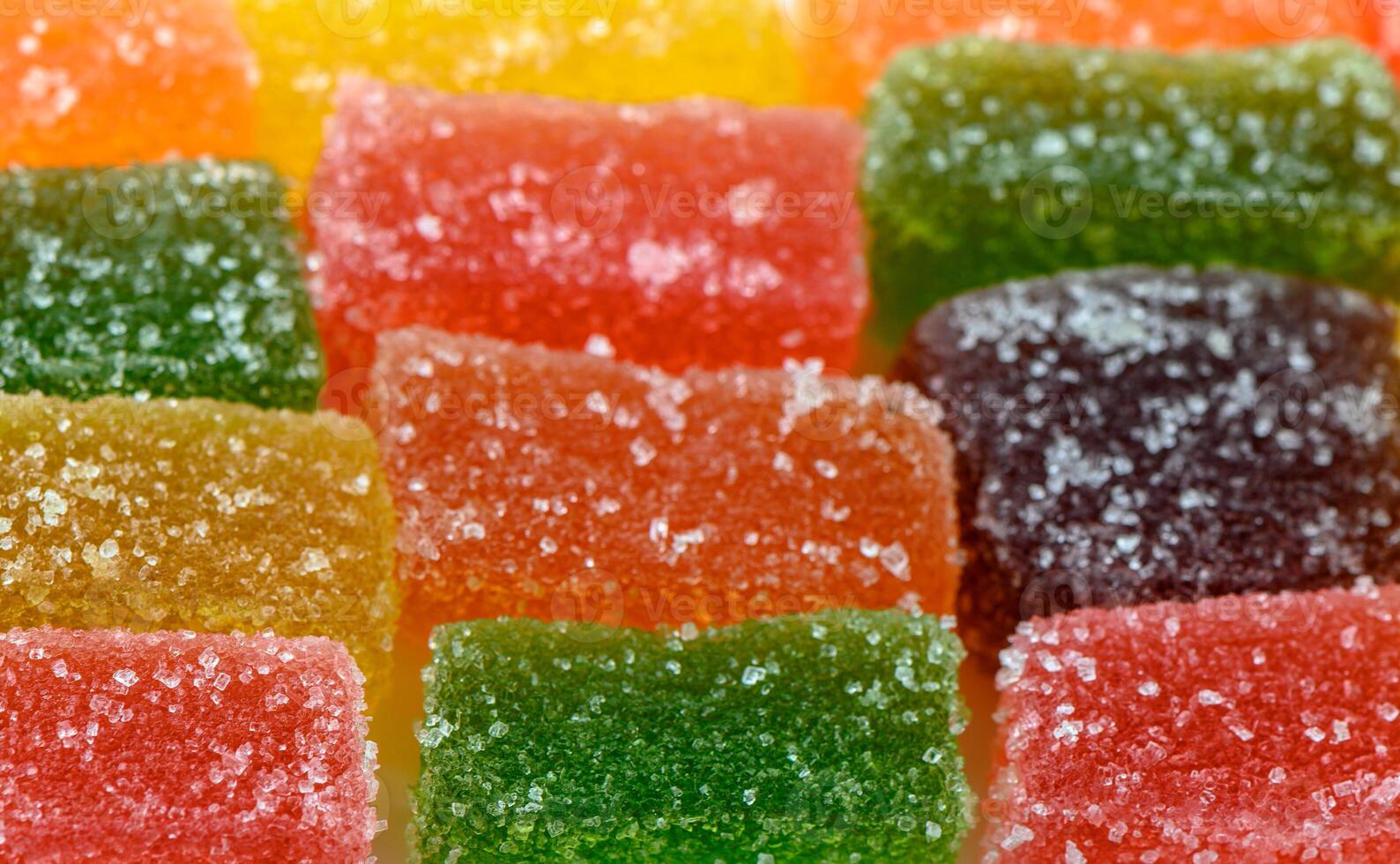 food background made of multi-colored marmalade photo