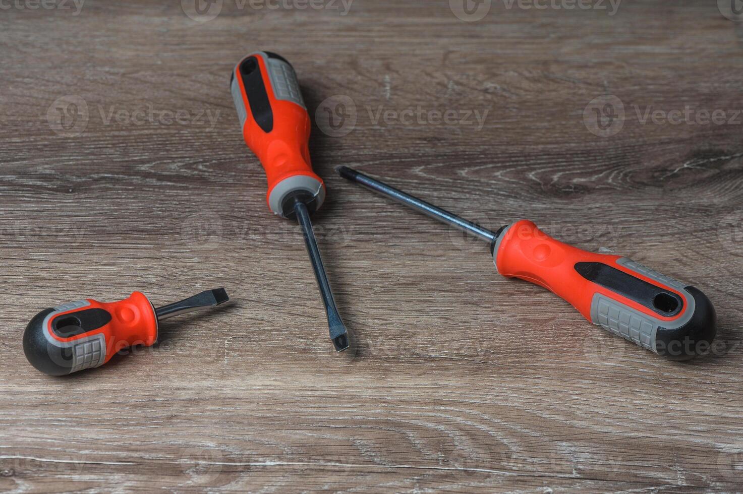 Screwdriver set on a wooden background top view copy space photo