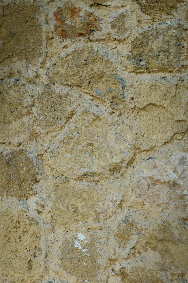 Stone wall texture background - grey stone siding with different sized stones 2 photo
